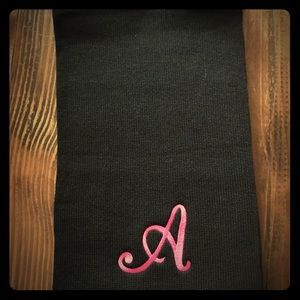 Black long knitted scarf with A initial.